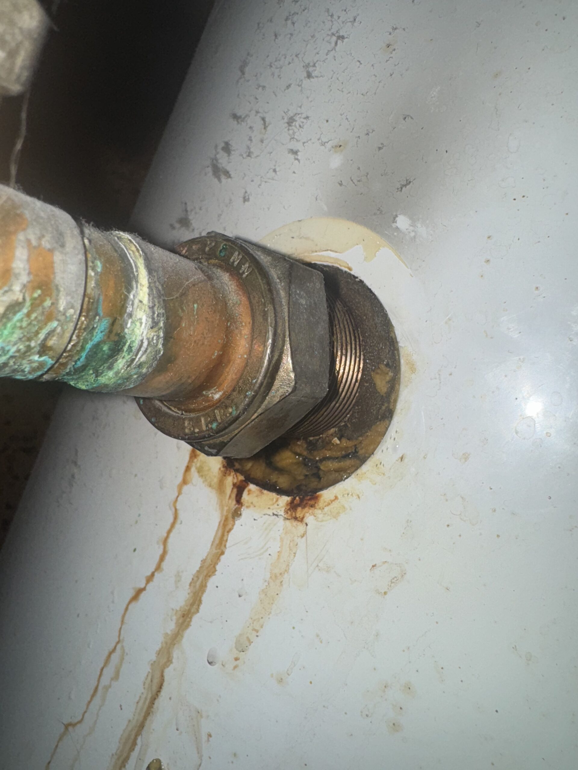 Corroded copper pipe found in ceiling void during leak detection